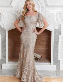 Model wearing an equisite mothers dress in front of an ornate fireplace in Pittsburgh PA