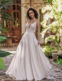 Model wearing a wedding dress in an exquisite garden background.