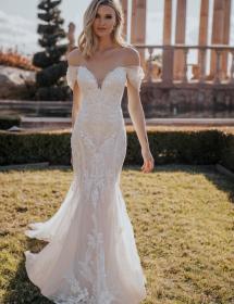 Model wearing a wedding dress in a garden