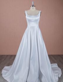 Mannequin modeling a bridal beginnings wedding dress