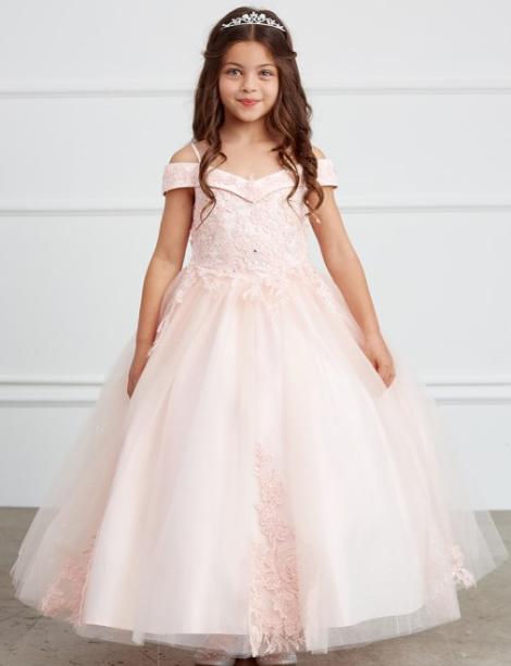 Blush color flower girl dress being modeled by a small girl