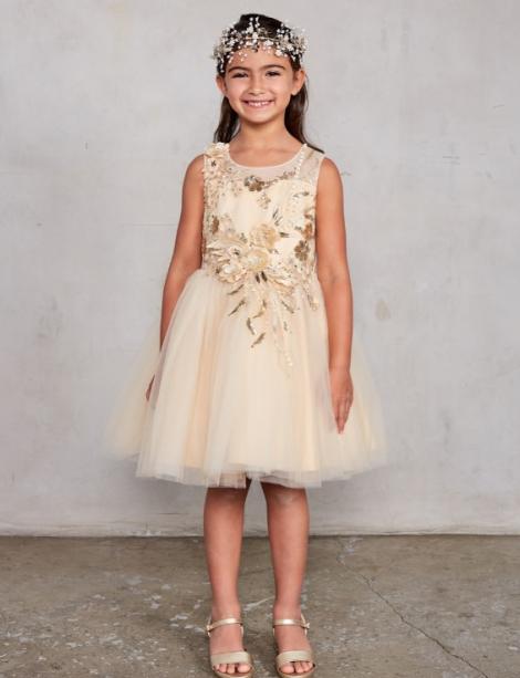 Little girl modeling a gold flower girl dress