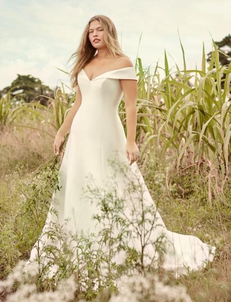 Beautiful model in a cornfield modeling a great looking wedding dress