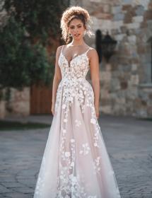 Model wearing a wedding dress in a patio area