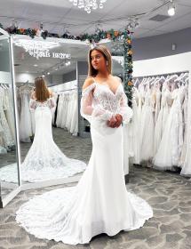 Beautiful Maja Bella gown modeled in front of a mirror at Pittsburgh Bridal store MB Bride