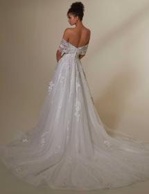 Model showing the back of a gorgeous wedding dress.