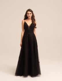 Model wearing a black wedding dress in front of a plain background.