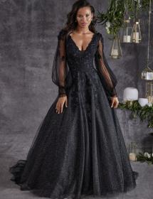 Plus size Black model wearing a beautiful black wedding dress in front of hanging lights 