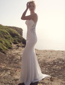 PIttsburgh bride modeling her wedding dress near the ocean