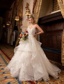 Model wearing a wedding dress in an ornate hall