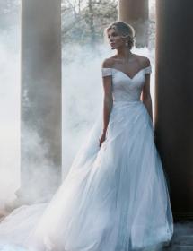 Image of woman modeling bridal gown in a dreamy setting