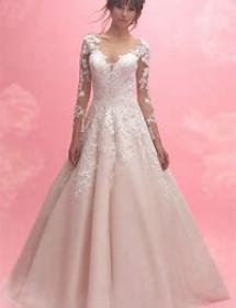 Model with a bridal dress in front of a pink dreamy background