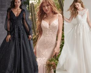 Three models wearing wedding dresses. One dress is black. 