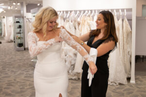 Picture of a bride shopping at MB Bride with their award winning consultants helping!