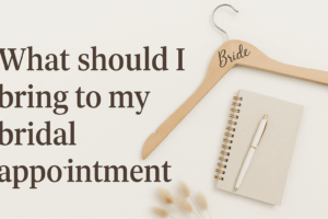 Image displaying a note pad, paper and hanger with text that says" What should I bring to my bridal appointment."